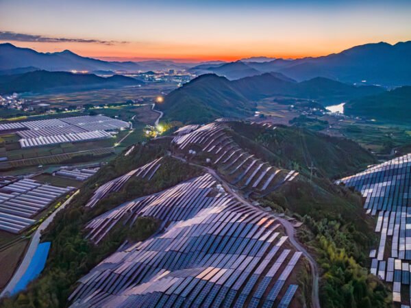 Aerial photography of photovoltaic panels on a mountain, China