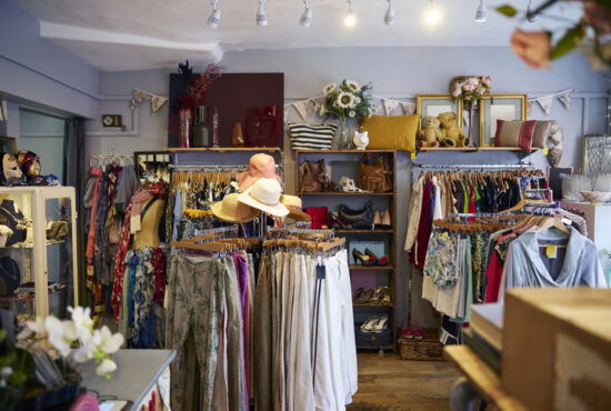 Interior of charity shop selling used and sustainable clothing and household goods